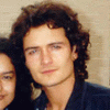 Orlando Bloom (Paris) posing with a fan.